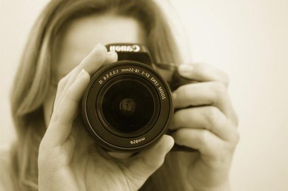 Photographer holding a camera